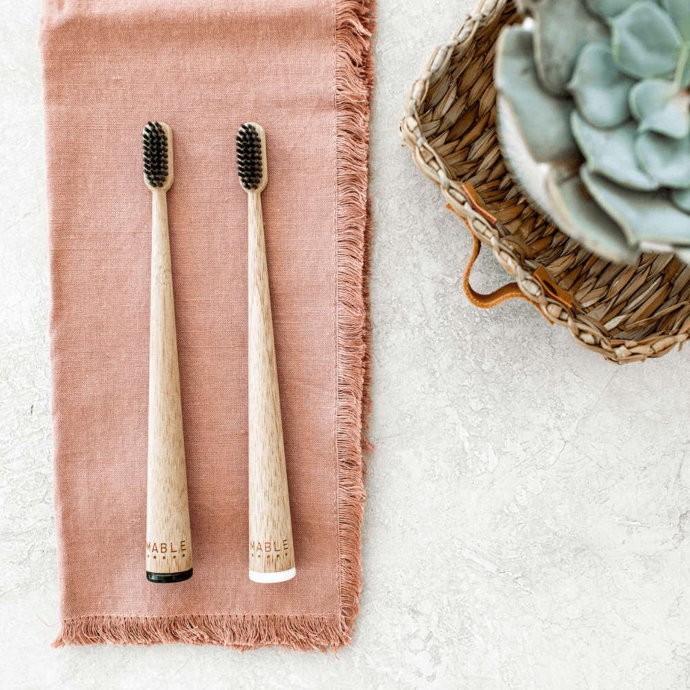 MABLE products are ethically made, Quality bamboo toothbrush set on neutral background with cactus blurred in the background 